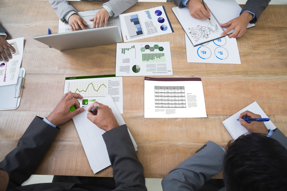 Brainstorm graphic against business interface with graphs and data